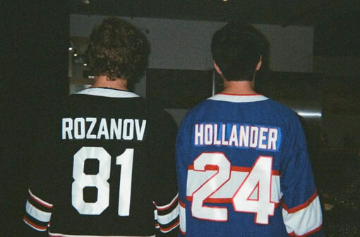 hollander and rozanov standing next to each other with 81 and 24 jersey numbers visible